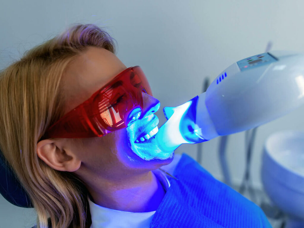 Patient receiving a teeth whitening treatment