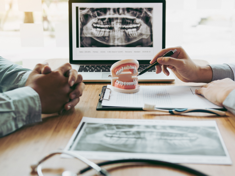 Doctor and patient discussing dentures