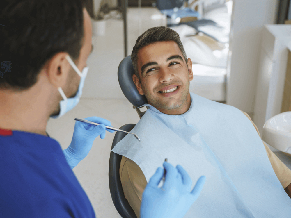 Patient smiling up at his doctor