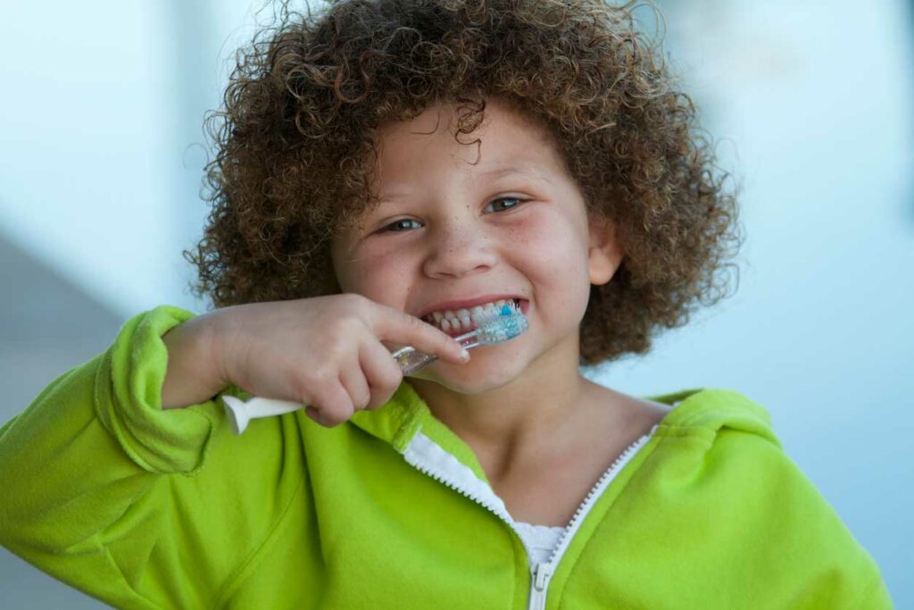 Little boy brushing his teeth.
